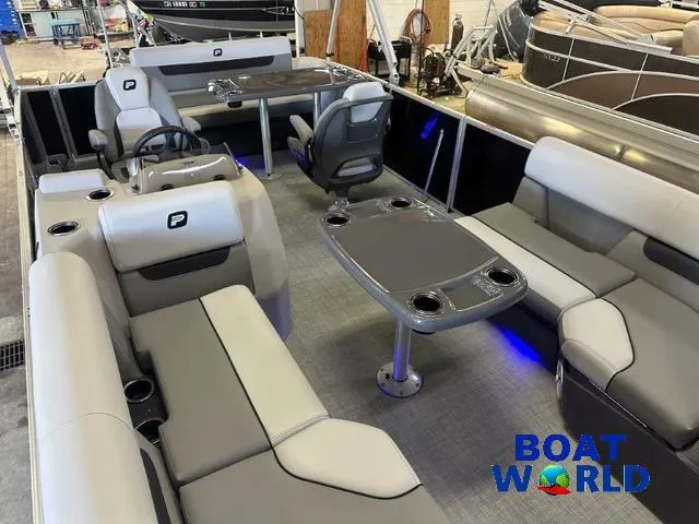 Slide: The Image of 2025 Princecraft Vectra 21 RL SS pontoon boat interior with modern seating and table setup. - 28