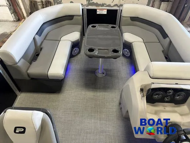 Slide: The Image of 2025 Princecraft Vectra 21 RL SS pontoon interior with seating and table, Boat World logo. - 29