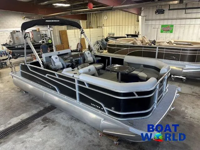 Slide: The Image of 2025 Princecraft Vectra 21 RL SS pontoon boat in showroom, featuring sleek design and seating. - 3