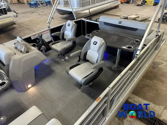 Slide: The Image of 2025 Princecraft Vectra 21 RL SS pontoon interior with seating and table, showcased at Boat World. - 5