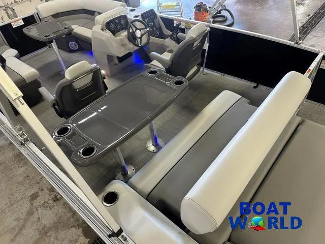 Slide: The Image of 2025 Princecraft Vectra 21 RL SS pontoon interior with seating and table, Boat World logo. - 6
