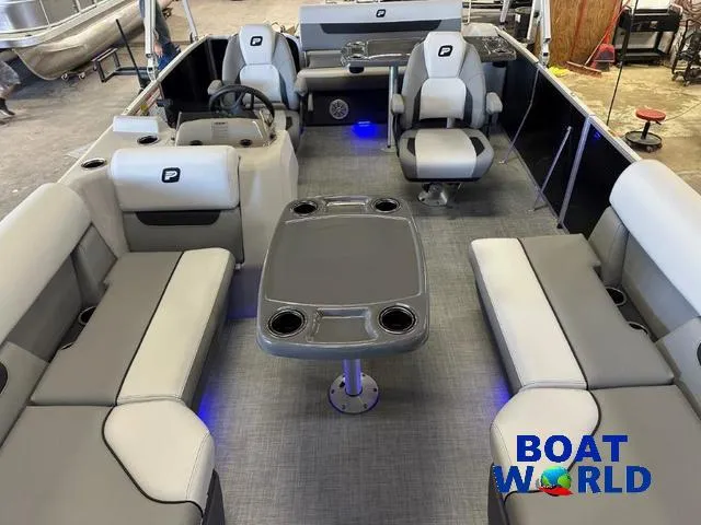 Slide: The Image of 2025 Princecraft Vectra 21 RL SS pontoon interior with seating and table, showcased by Boat World. - 8