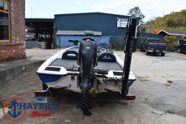 Slide: The Image of 2007 Stratos 176XT boat at Thayer's Marine, rear view with motor and trailer. - 11