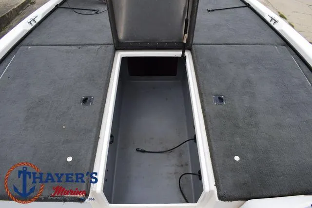 Slide: The Image of 2007 Stratos 176XT boat storage compartment with open hatch, featuring Thayer's Marine logo. - 15