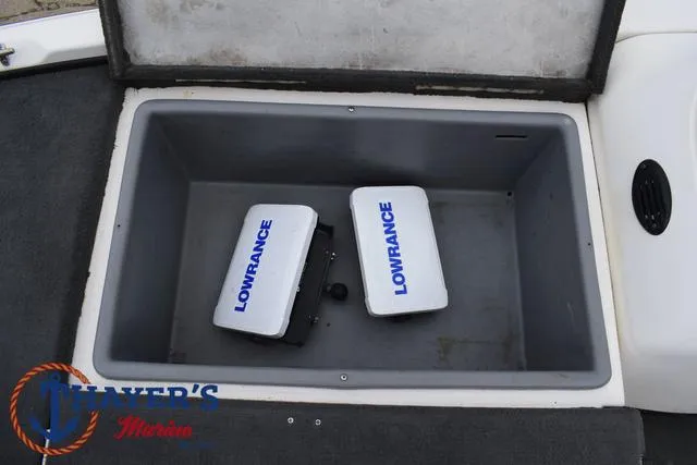 Slide: The Image of 2007 Stratos 176XT storage compartment with Lowrance equipment inside. - 16