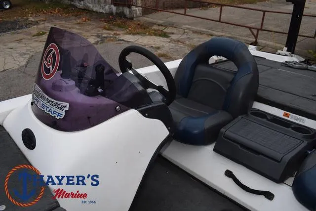 Slide: The Image of 2007 Stratos 176XT boat cockpit with steering wheel and seating, Thayer's Marine logo visible. - 22