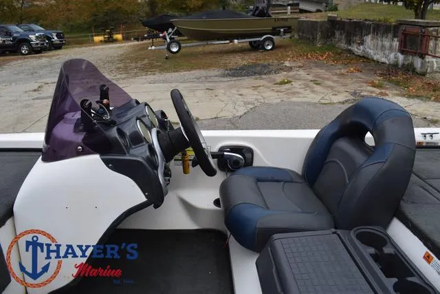 Slide: The Image of 2007 Stratos 176XT boat interior with steering wheel and seating at Thayer's Marine. - 23