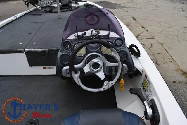 Slide: The Image of 2007 Stratos 176XT boat dashboard with steering wheel and gauges. - 24