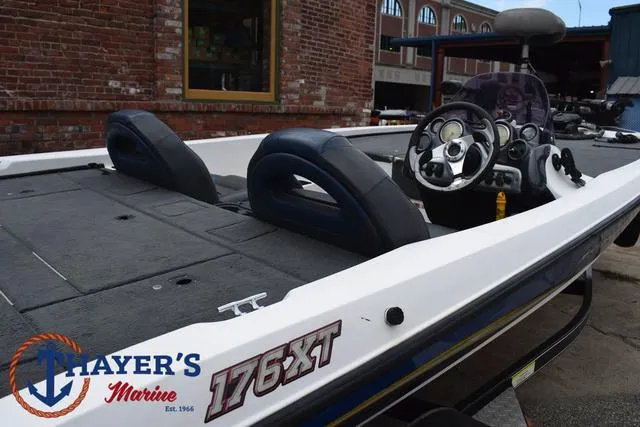 Slide: The Image of 2007 Stratos 176XT boat at Thayer's Marine, featuring steering console and seating. - 31