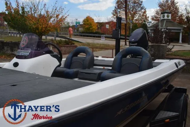 Slide: The Image of 2007 Stratos 176XT boat at Thayer's Marine, featuring dual seats and autumn backdrop. - 32