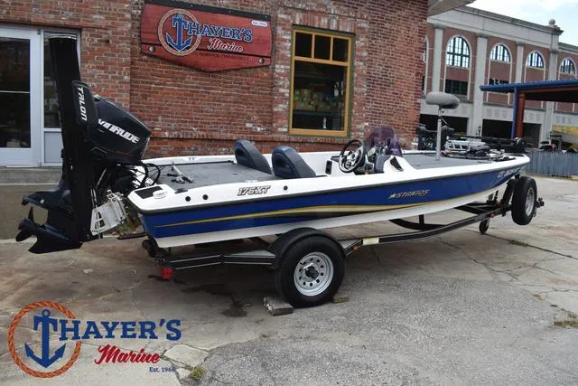 Slide: The Image of 2007 Stratos 176XT boat at Thayer's Marine, featuring Evinrude motor, parked outdoors. - 35