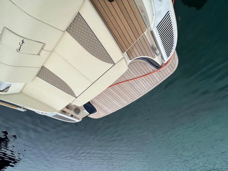 Slide: The Image of 2025 Chris-Craft Launch 35 GT boat with elegant deck and seating on calm water. - 16