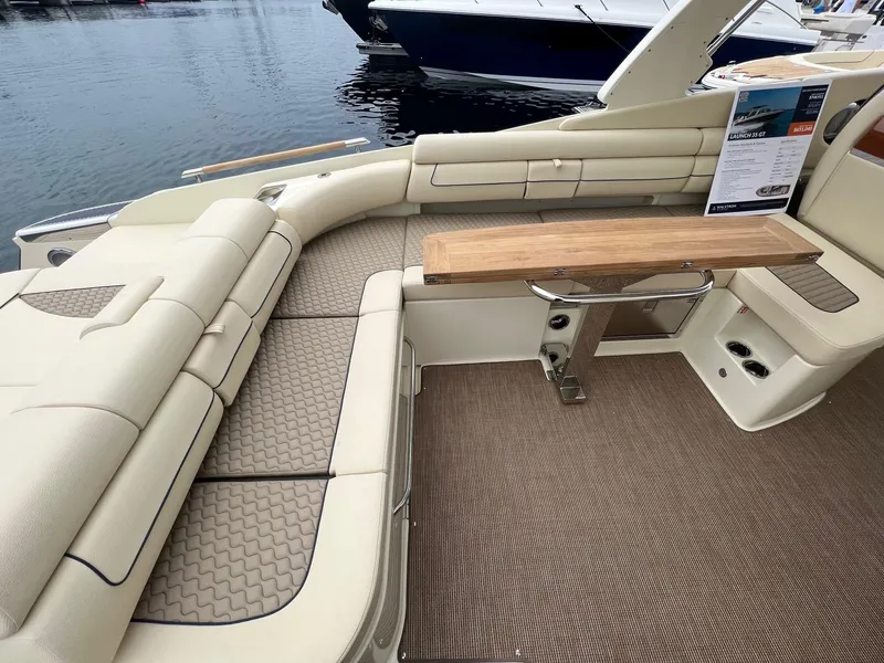Slide: The Image of Luxurious interior of 2025 Chris-Craft Launch 35 GT boat with elegant seating and wooden table. - 19