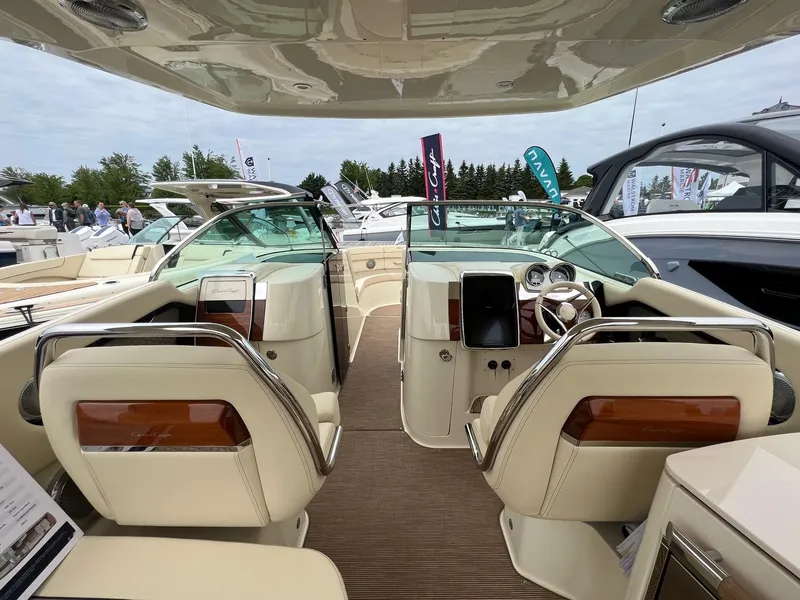 Slide: The Image of 2025 Chris-Craft Launch 35 GT interior with luxurious seating and modern dashboard. - 20