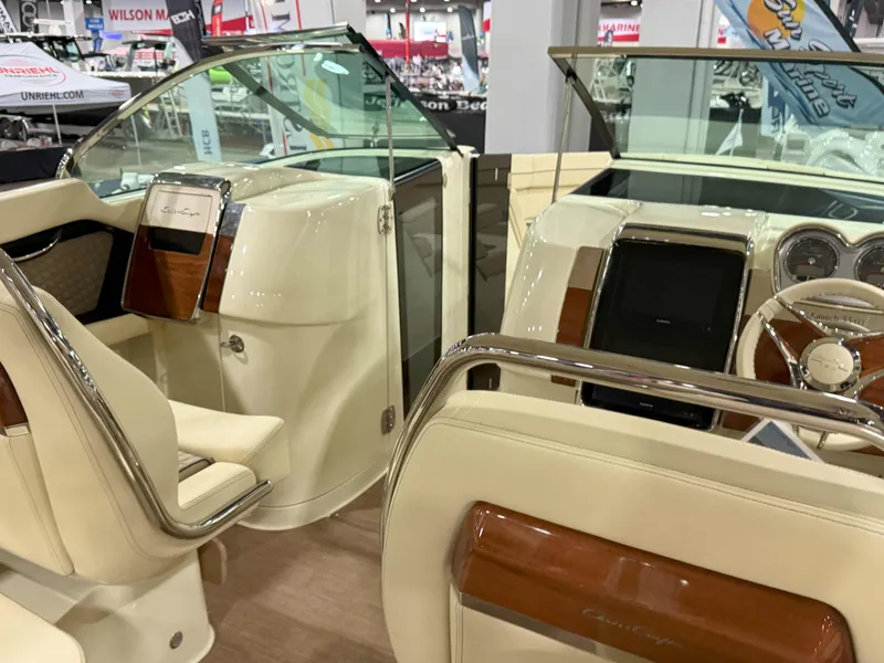 Slide: The Image of Interior view of 2025 Chris-Craft Launch 35 GT boat, featuring elegant seating and dashboard. - 5