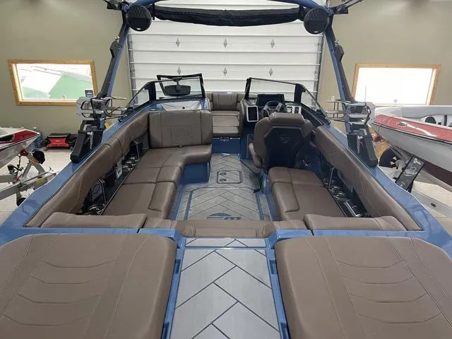 Slide: The Image of 2024 Malibu 23 LSV boat interior with spacious seating and modern design. - 12