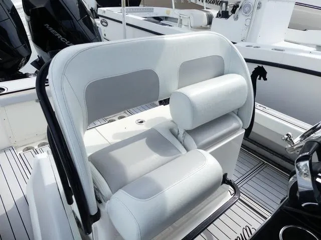 Slide: The Image of 2018 ShearWater 270 Carolina Flare boat seating with white and gray upholstery. - 11