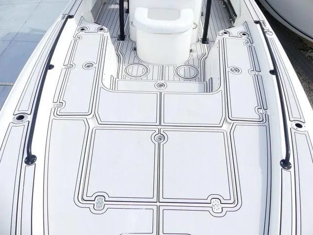 Slide: The Image of 2018 ShearWater 270 Carolina Flare boat deck with sleek design and seating. - 18