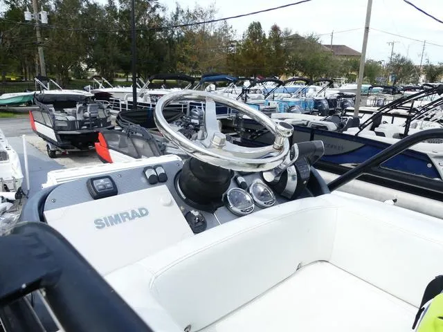 Slide: The Image of 2018 ShearWater 270 Carolina Flare boat dashboard with Simrad electronics. - 21