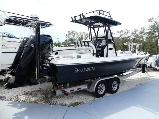 Slide: The Image of 2018 ShearWater 270 Carolina Flare boat on trailer, parked outdoors. - 4