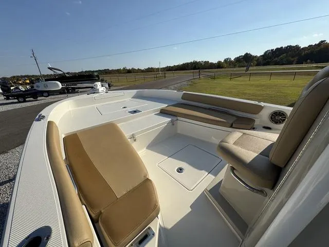 Slide: The Image of 2018 Ranger 2350 Bay boat interior with tan seating and open deck. - 6