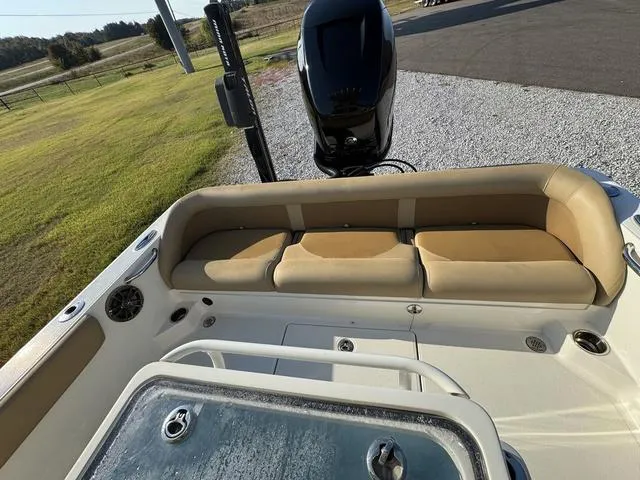 Slide: The Image of 2018 Ranger 2350 Bay boat with cushioned seating and outboard motor. - 8