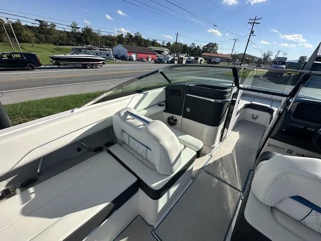 Slide: The Image of 2023 Regal LS6 boat interior with white seating and modern dashboard. - 11