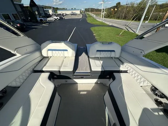 Slide: The Image of 2023 Regal LS6 boat interior with luxurious white seating and modern design. - 14