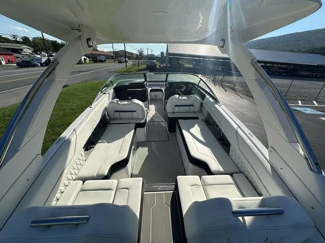 Slide: The Image of 2023 Regal LS6 boat interior with luxurious white seating and modern design. - 9