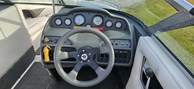 Slide: The Image of 1993 MasterCraft Maristar 225 dashboard with steering wheel and gauges. - 11