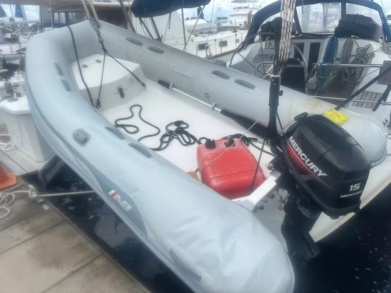 Slide: The Image of Inflatable dinghy with Mercury outboard motor on a 2006 Beneteau 393 sailboat. - 29