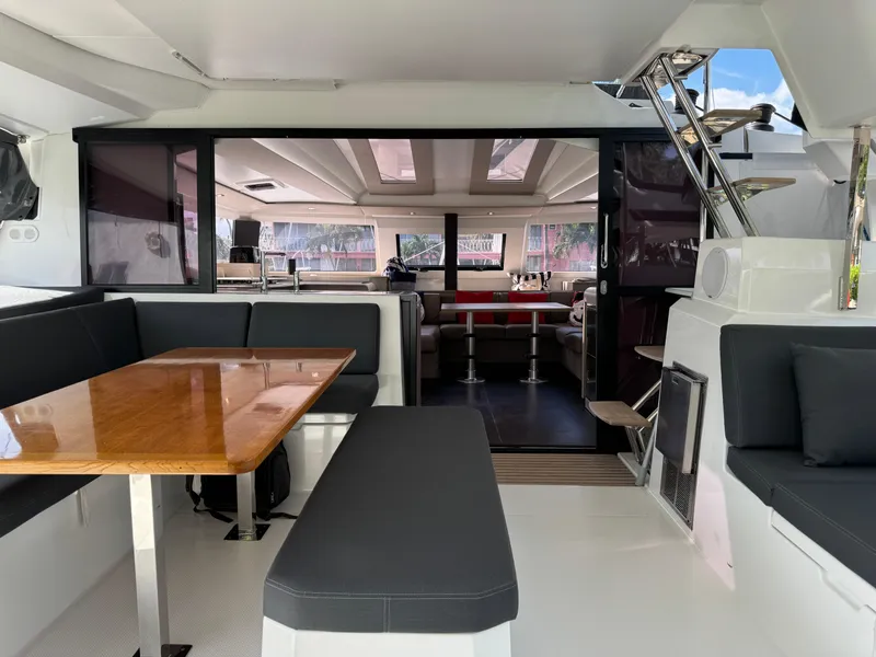 Slide: The Image of Spacious interior of 2020 Fountaine Pajot Elba 45 catamaran with modern seating and dining area. - 10