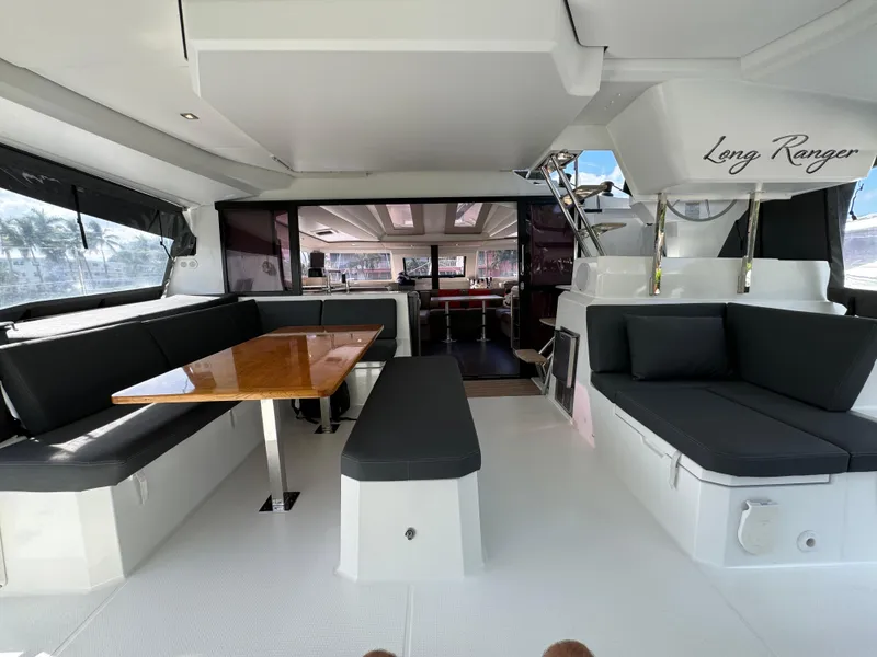 Slide: The Image of Spacious interior of 2020 Fountaine Pajot Elba 45 catamaran with modern seating and dining area. - 11