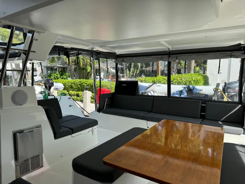 Slide: The Image of Interior of 2020 Fountaine Pajot Elba 45 catamaran with seating and wooden table. - 20