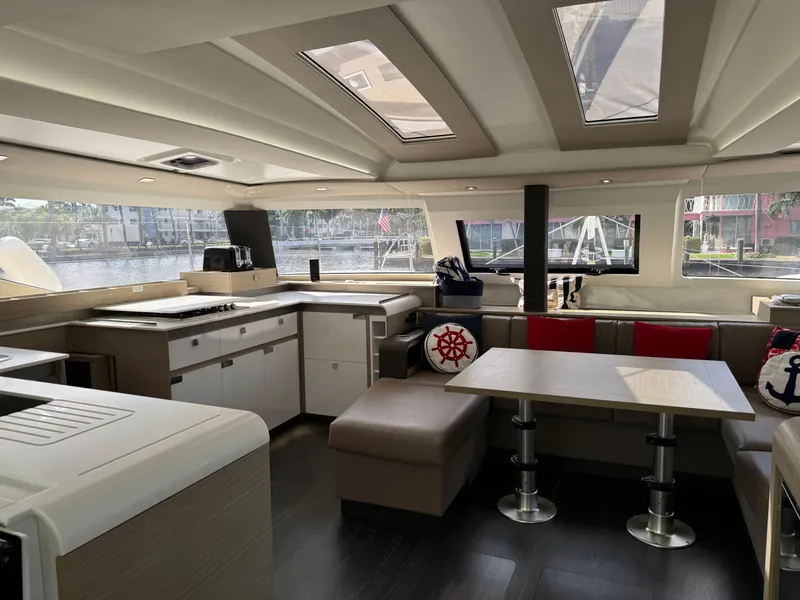 Slide: The Image of Luxurious interior of 2020 Fountaine Pajot Elba 45 catamaran with modern kitchen and seating area. - 26