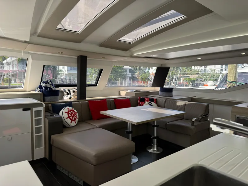 Slide: The Image of Interior of 2020 Fountaine Pajot Elba 45 catamaran with modern seating and skylights. - 29