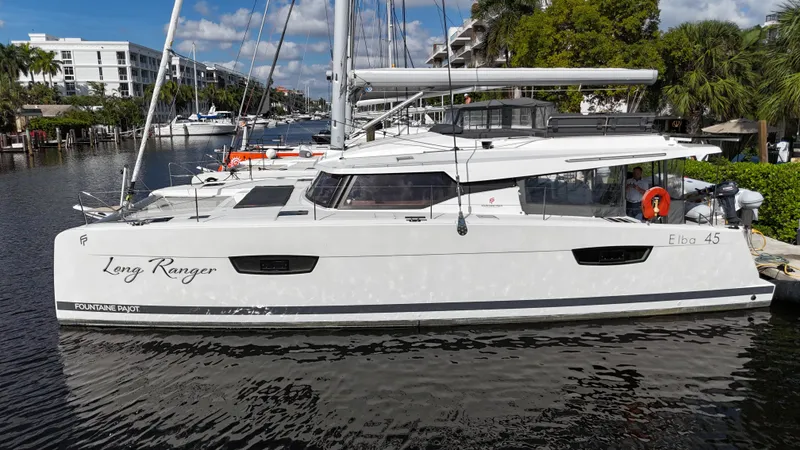 Slide: The Image of 2020 Fountaine Pajot Elba 45 catamaran docked in a marina. - 3