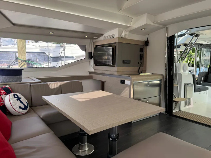 Slide: The Image of Interior of 2020 Fountaine Pajot Elba 45 catamaran with modern seating and decor. - 30