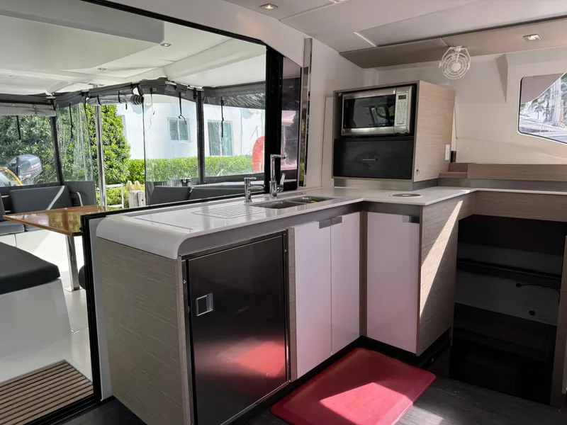Slide: The Image of Modern kitchen interior of 2020 Fountaine Pajot Elba 45 catamaran, featuring sleek design and appliances. - 32