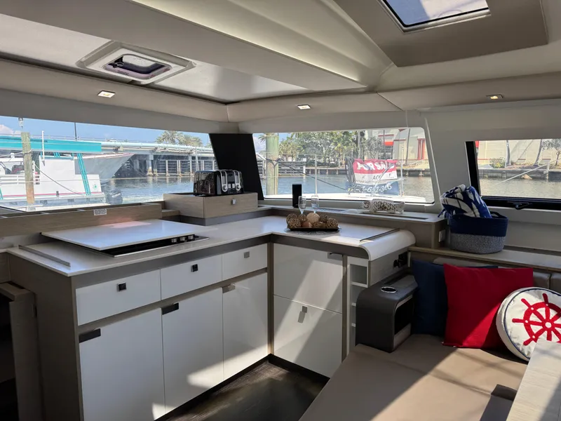 Slide: The Image of Interior of 2020 Fountaine Pajot Elba 45 yacht, featuring modern kitchen and seating area. - 33
