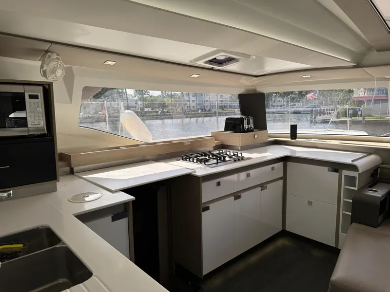 Slide: The Image of Modern kitchen interior of 2020 Fountaine Pajot Elba 45 yacht with waterfront view. - 35
