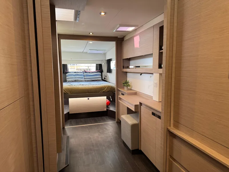 Slide: The Image of Interior of 2020 Fountaine Pajot Elba 45 catamaran, featuring modern wood finishes and cozy bedroom. - 37