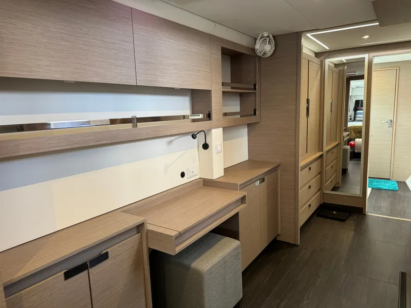 Slide: The Image of Interior of 2020 Fountaine Pajot Elba 45 yacht with modern wood cabinetry and workspace. - 38