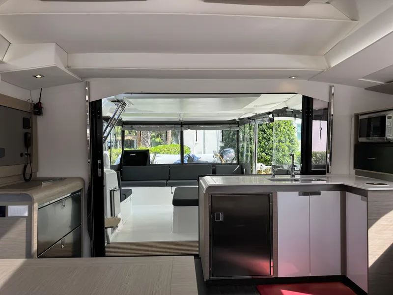 Slide: The Image of Modern interior of 2020 Fountaine Pajot Elba 45 catamaran with sleek kitchen and spacious seating area. - 50