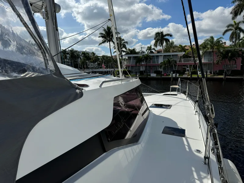 Slide: The Image of Fountaine Pajot Elba 45 catamaran docked by palm trees, 2020 model. - 52