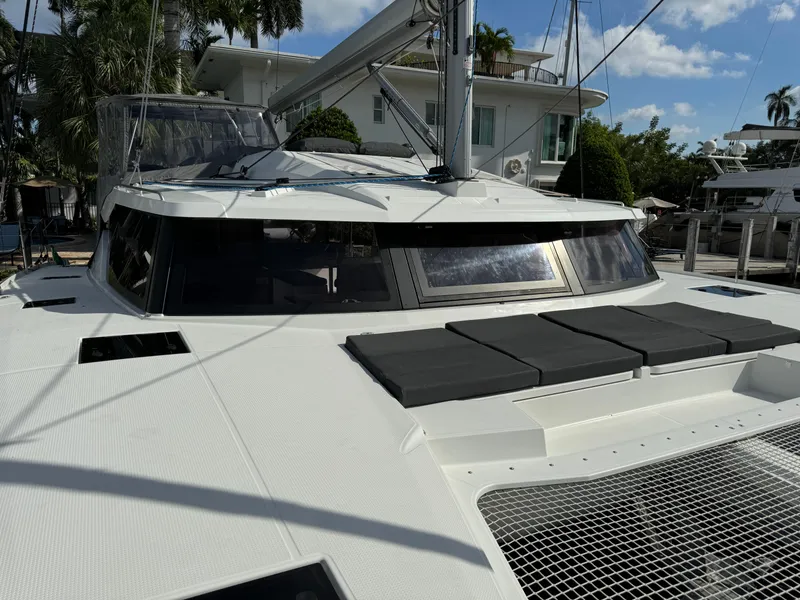 Slide: The Image of Fountaine Pajot Elba 45 catamaran, 2020 model, docked with sun pads and netting. - 53