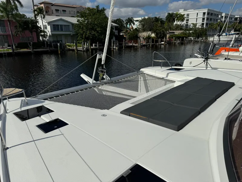 Slide: The Image of Fountaine Pajot Elba 45 catamaran, 2020 model, docked by waterfront homes. - 55