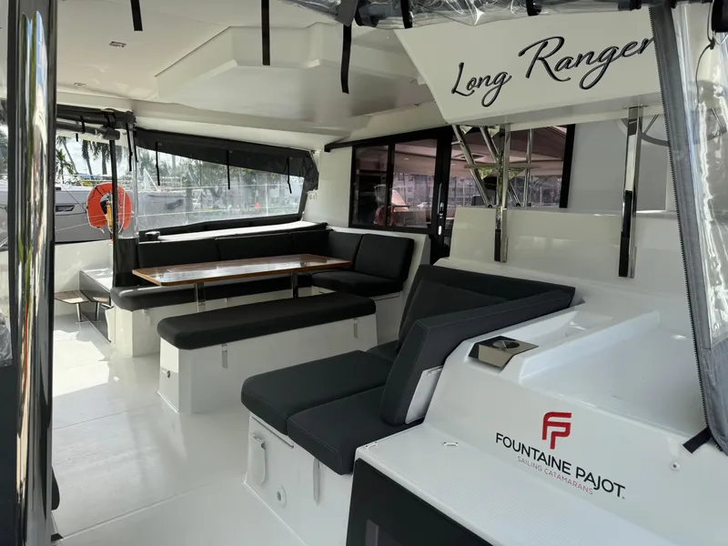 Slide: The Image of 2020 Fountaine Pajot Elba 45 catamaran interior with seating and dining area. - 8