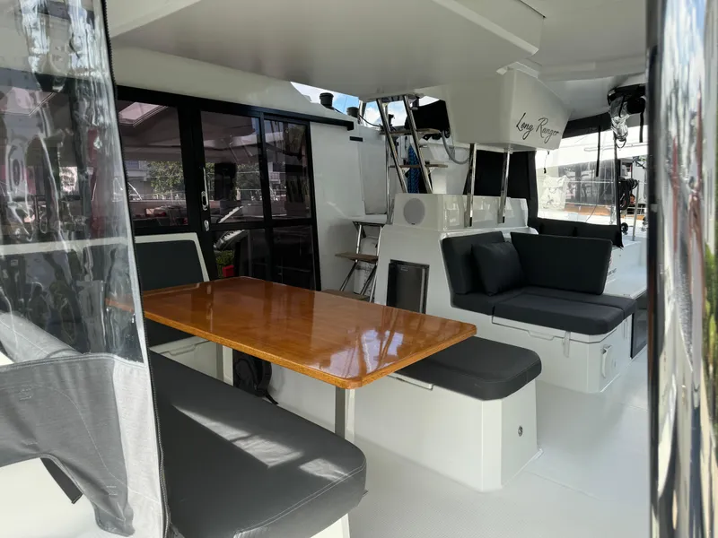 Slide: The Image of Interior of 2020 Fountaine Pajot Elba 45 catamaran with seating and dining area. - 9