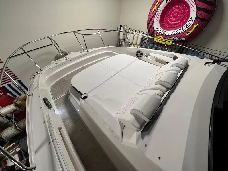 Slide: The Image of 2025 Sea Ray Sundancer 320 Coupe with spacious deck and modern design. - 15